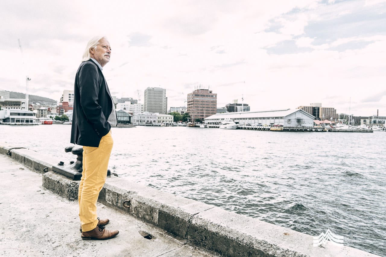 Gustaaf Hallegraeff standing in front of the Hobart waterfront